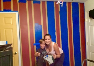 Jennifer and Spencer painting the stripes on that wall. FrogTape was the answer.