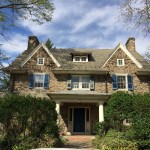 BEFORE: blue shutters and bright white trim. Dark blue front door. Arrgh!