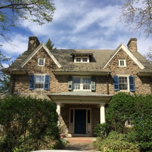BEFORE: blue shutters and bright white trim. Dark blue front door. Arrgh!