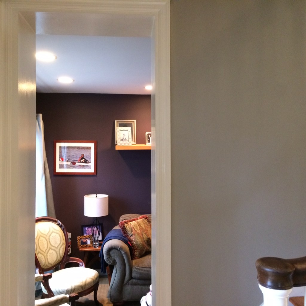 Here's a view into that cozy TV/den from the rich neutral walls in the living room.