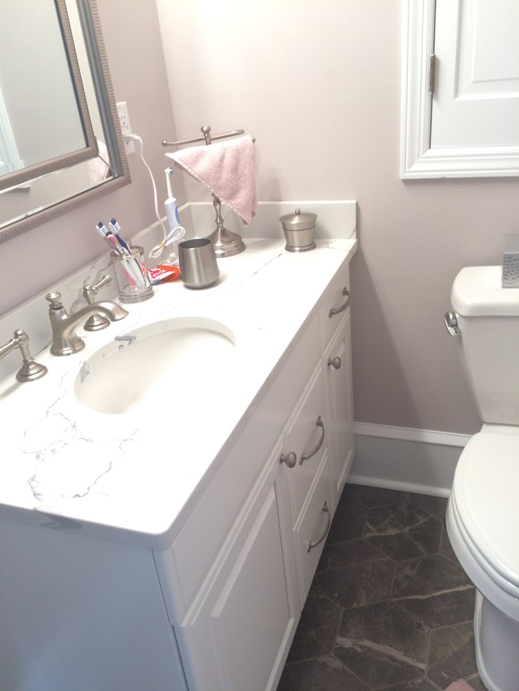 We looked at several whites before choosing this one that works with the wall color and the white fixtures.