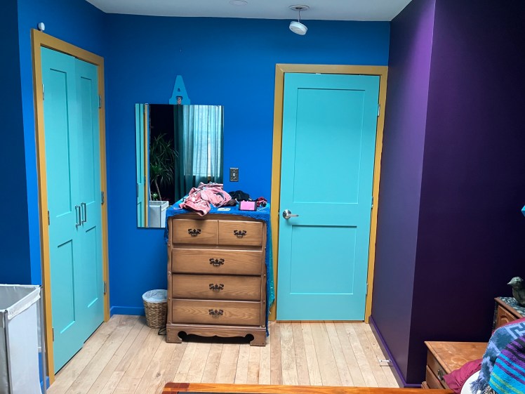 For Client CJ, a creative, we chose that deep delicious plum and the turquoise to add more magic to that blue in the bedroom.